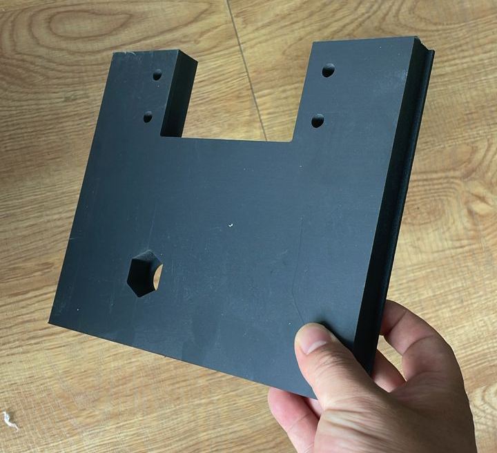 Technical part in 19 mm black expanded PVC cut and drilled on a VERSO CNC machine